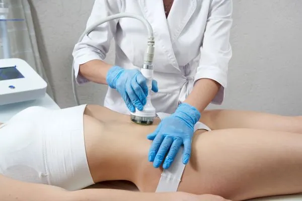Lost the Weight but Not the Loose Skin? 2 woman having HIFU treatment on her stomach to combat loose skin Eton following weight loss